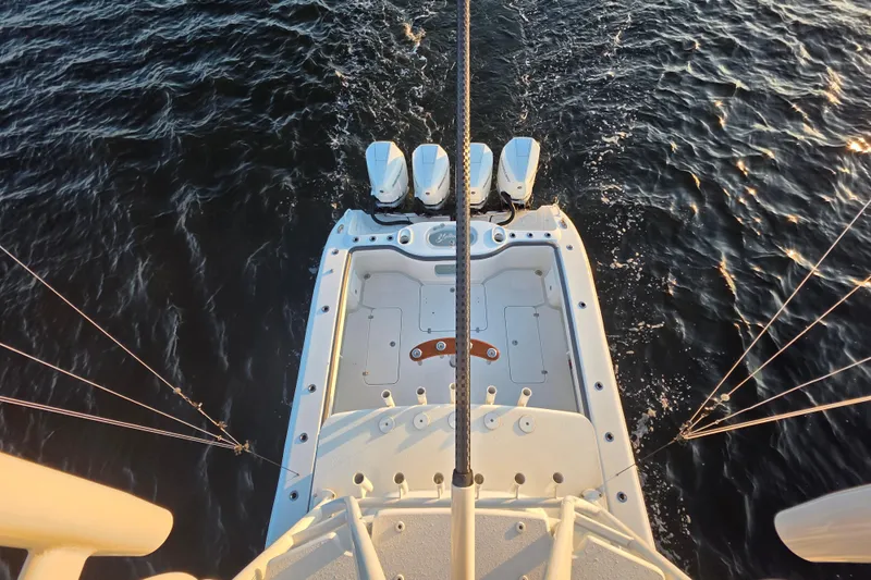 T/t One More Day Yacht Photos Pics 2019 Yellowfin 42 Offshore boat with triple engines on open water.