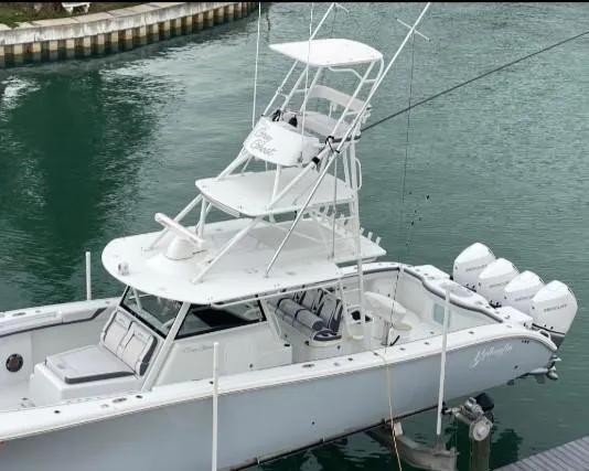 One More Day Yacht Photos Pics 2019 Yellowfin Center Console boat docked with multiple outboard engines.