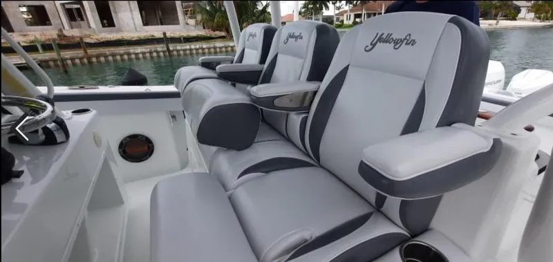 One More Day Yacht Photos Pics 2019 Yellowfin Center Console boat with luxurious seating and armrests.