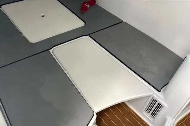 One More Day Yacht Photos Pics 2019 Yellowfin Center Console boat interior with cushioned seating and storage compartments.