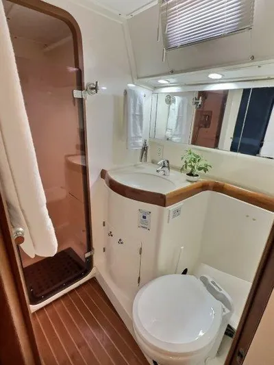 Celebrate Yacht Photos Pics 2003 Taswell 58 yacht bathroom with shower, sink, and toilet.