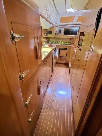 Celebrate Yacht Photos Pics Interior of 2003 Taswell 58 yacht with wooden cabinetry and modern amenities.