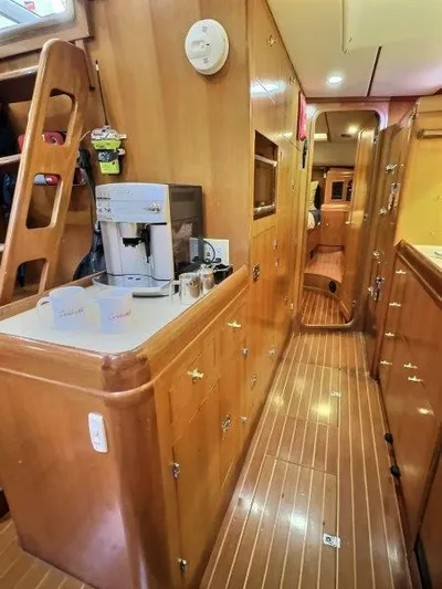 Celebrate Yacht Photos Pics Interior of 2003 Taswell 58 yacht with wooden cabinetry and modern appliances.