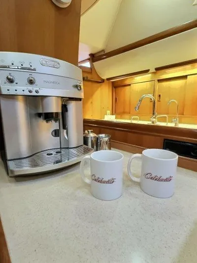 Celebrate Yacht Photos Pics Coffee maker and mugs in the kitchen of a 2003 Taswell 58 yacht.