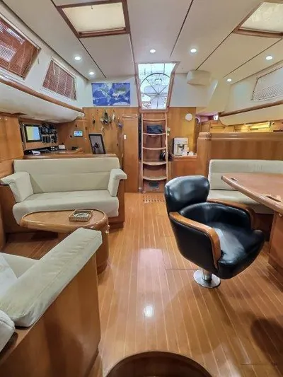 Celebrate Yacht Photos Pics Luxurious interior of a 2003 Taswell 58 yacht with elegant wood finishes.