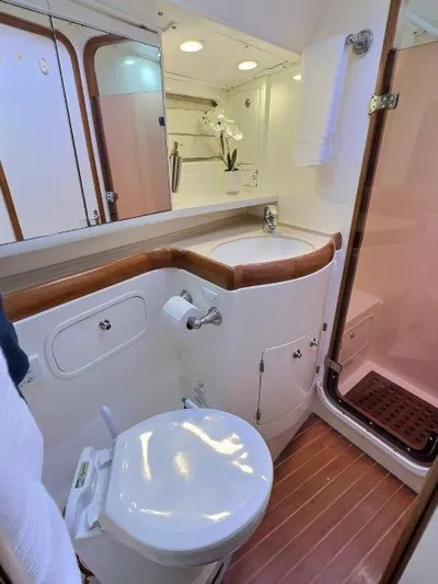 Celebrate Yacht Photos Pics Luxurious bathroom in 2003 Taswell 58 yacht with modern fixtures and wooden accents.
