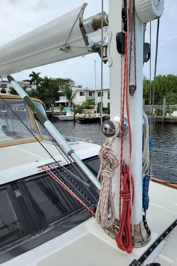 Celebrate Yacht Photos Pics 2003 Taswell 58 sailboat deck with mast, ropes, and waterfront view.