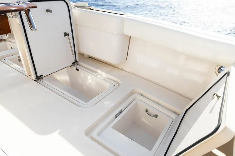 Pecado Yacht Photos Pics 2006 Bertram 510 Convertible yacht deck with open storage compartments.