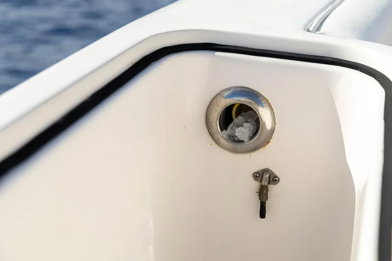 Pecado Yacht Photos Pics Close-up of a 2006 Bertram 510 Convertible boat detail with ocean background.