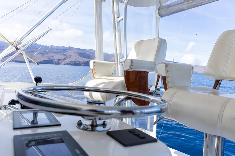 Pecado Yacht Photos Pics Luxury helm of 2006 Bertram 510 Convertible yacht with ocean view.