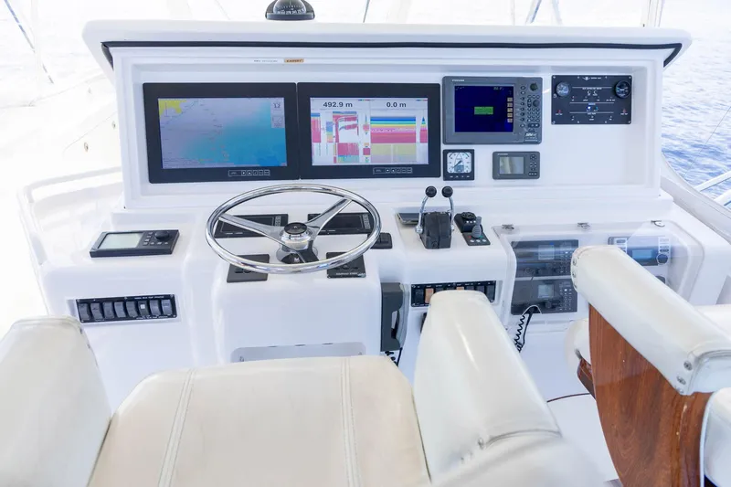 Pecado Yacht Photos Pics Helm of 2006 Bertram 510 Convertible yacht with navigation screens and controls.
