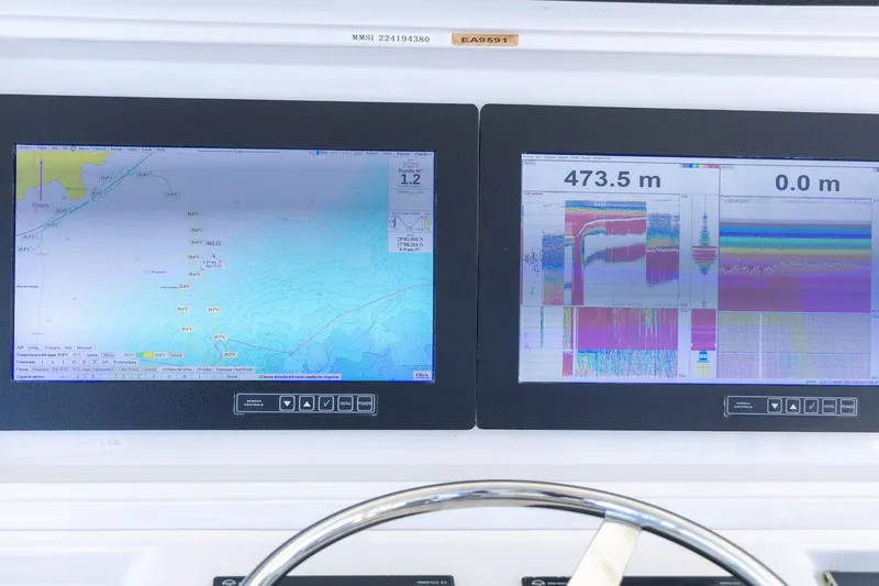 Pecado Yacht Photos Pics Navigation and sonar displays on a 2006 Bertram 510 Convertible yacht.
