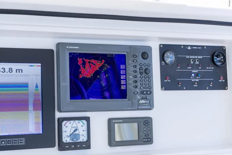Pecado Yacht Photos Pics Control panel of a 2006 Bertram 510 Convertible with navigation and monitoring systems.