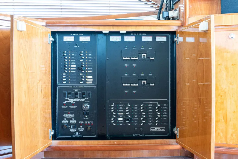 Pecado Yacht Photos Pics Electrical panel inside a 2006 Bertram 510 Convertible yacht, featuring switches and controls.