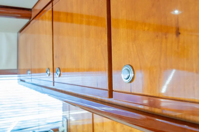 Pecado Yacht Photos Pics Wooden cabinetry detail in a 2006 Bertram 510 Convertible yacht interior.