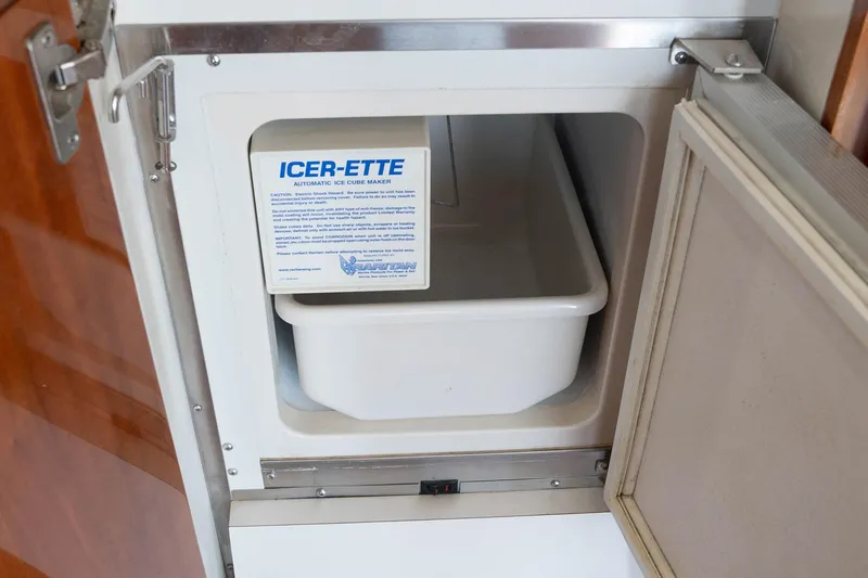 Pecado Yacht Photos Pics Ice maker compartment on a 2006 Bertram 510 Convertible yacht.