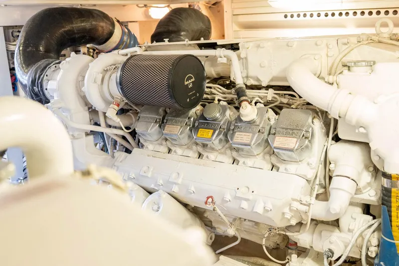 Pecado Yacht Photos Pics Engine room of a 2006 Bertram 510 Convertible yacht, showcasing detailed machinery.