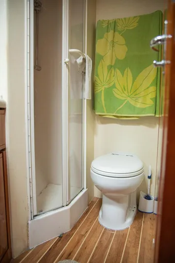 Pecado Yacht Photos Pics Bathroom interior of 2006 Bertram 510 Convertible yacht with shower and toilet.