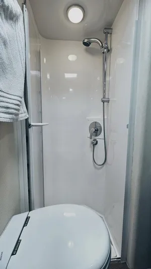 Pecado Yacht Photos Pics 2006 Bertram 510 Convertible yacht bathroom with shower and toilet.