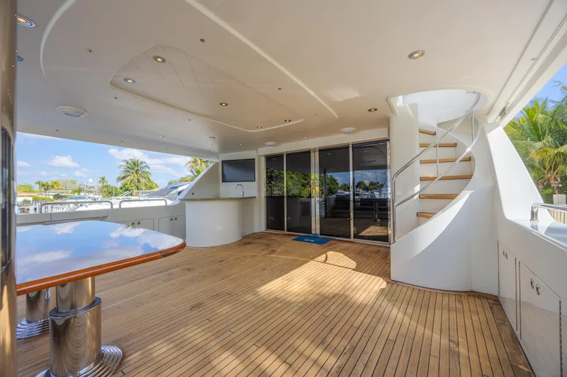 Cerca Trova Yacht Photos Pics Luxurious 2011 Westport 112 yacht deck with wooden flooring and spiral staircase.