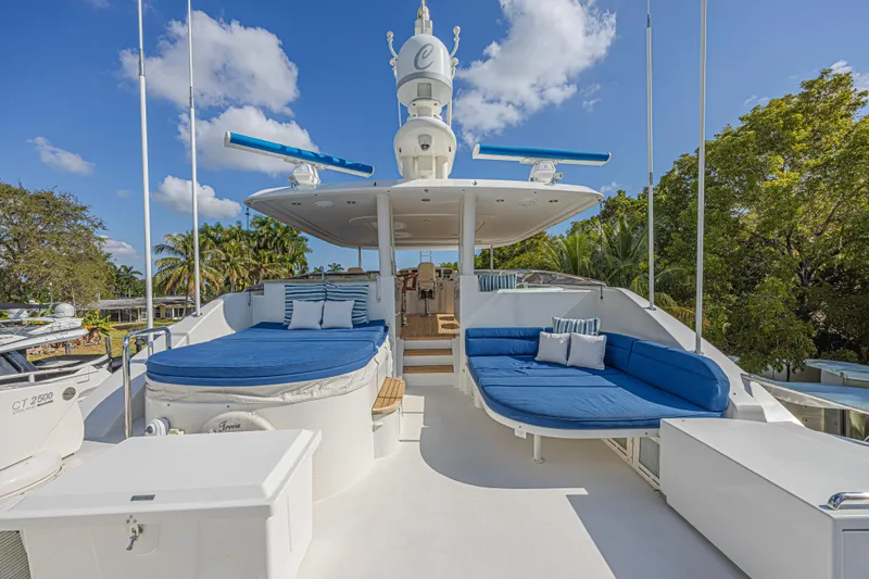 Cerca Trova Yacht Photos Pics Luxurious 2011 Westport 112 yacht deck with blue seating and clear skies.