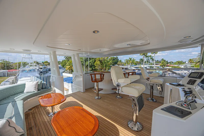 Cerca Trova Yacht Photos Pics Luxurious 2011 Westport 112 yacht deck with seating, helm chairs, and scenic marina view.