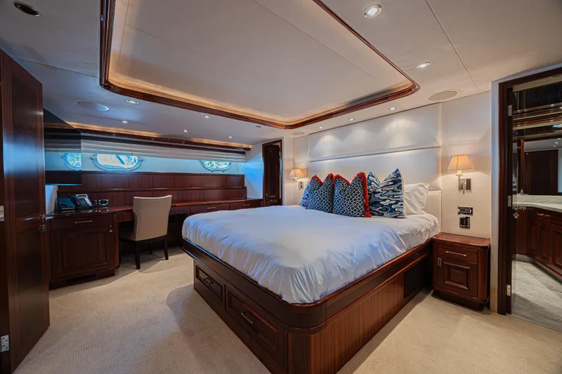 Cerca Trova Yacht Photos Pics Luxurious bedroom interior on 2011 Westport 112 yacht, featuring elegant wood finishes and plush bedding.