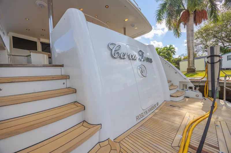 Cerca Trova Yacht Photos Pics Luxury yacht Westport 112, 2011 model, docked with elegant wooden steps and palm trees.
