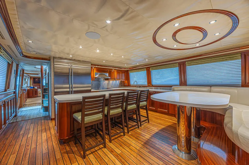 Cerca Trova Yacht Photos Pics Luxurious interior of 2011 Westport 112 yacht with elegant wood flooring and modern kitchen.