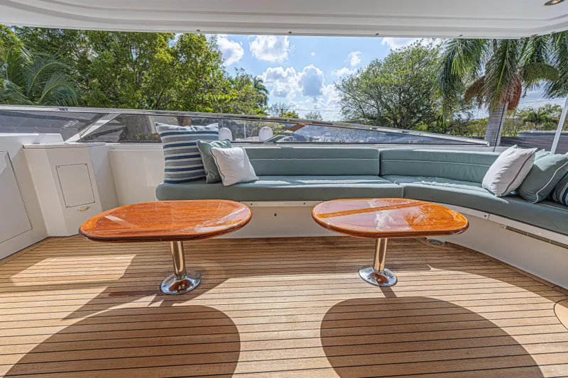 Cerca Trova Yacht Photos Pics Luxurious 2011 Westport 112 yacht deck with elegant seating and wooden tables.