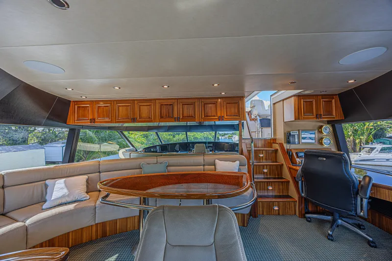 Cerca Trova Yacht Photos Pics Luxurious interior of 2011 Westport 112 yacht with elegant seating and wooden cabinetry.