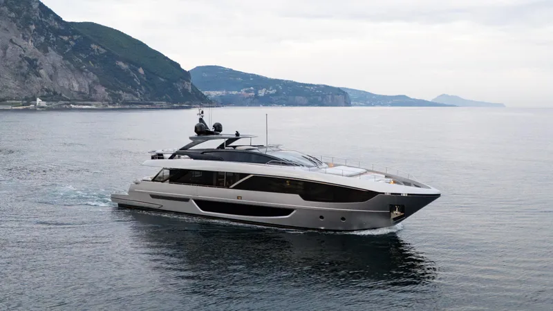 Stile Di Vita Yacht Photos Pics Luxury Riva 102 Super Cosaro yacht cruising near scenic coastline, 2023 model.
