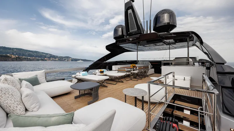 Stile Di Vita Yacht Photos Pics Luxurious 2023 Riva 102 Super Cosaro yacht deck with elegant seating and ocean view.