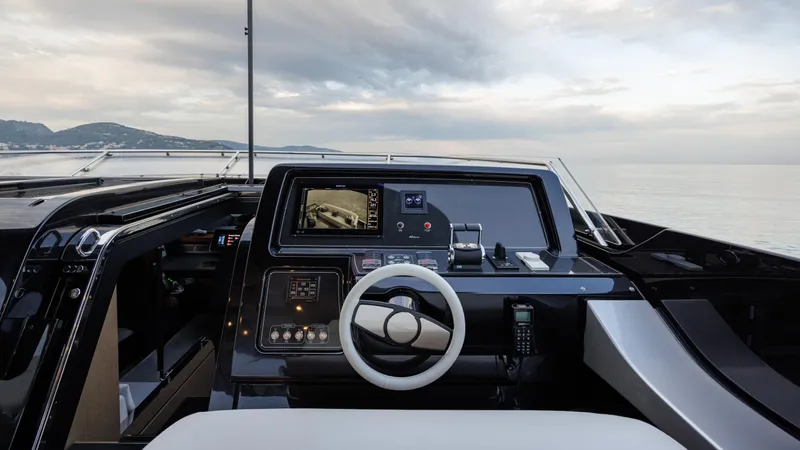 Stile Di Vita Yacht Photos Pics 2023 Riva 102 Super Cosaro yacht cockpit with modern navigation controls and ocean view.
