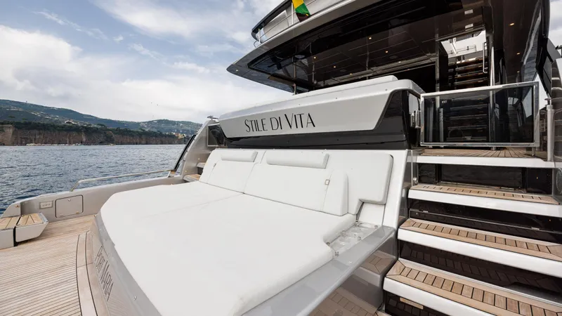 Stile Di Vita Yacht Photos Pics Luxurious 2023 Riva 102 Super Cosaro yacht with elegant deck and scenic ocean view.
