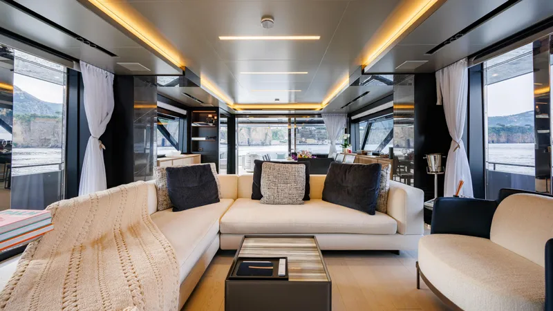 Stile Di Vita Yacht Photos Pics Luxurious interior of 2023 Riva 102 Super Cosaro yacht with elegant seating and modern decor.