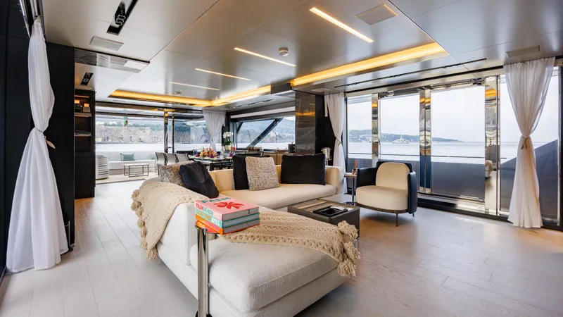 Stile Di Vita Yacht Photos Pics Luxurious interior of 2023 Riva 102 Super Cosaro yacht with modern furnishings and panoramic windows.