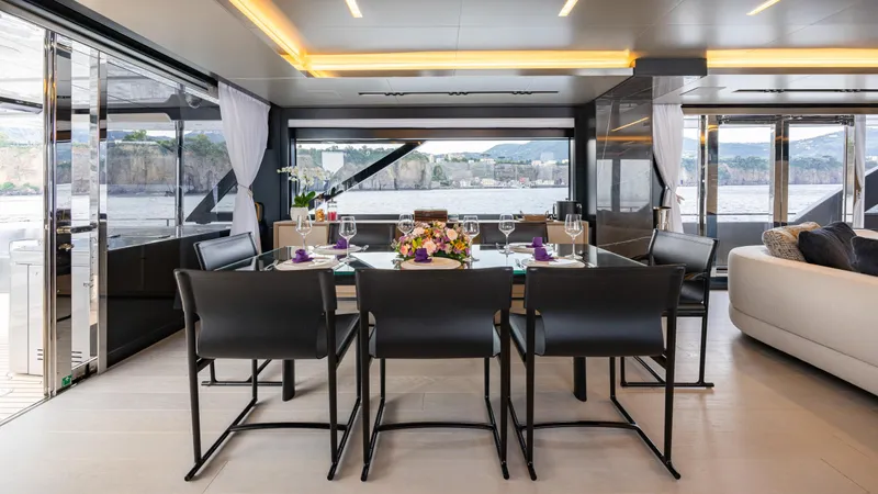 Stile Di Vita Yacht Photos Pics Luxurious interior of 2023 Riva 102 Super Cosaro yacht with elegant dining area.