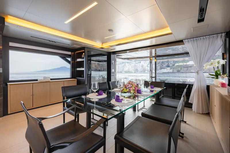 Stile Di Vita Yacht Photos Pics Luxurious dining area on 2023 Riva 102 Super Cosaro yacht with scenic ocean views.