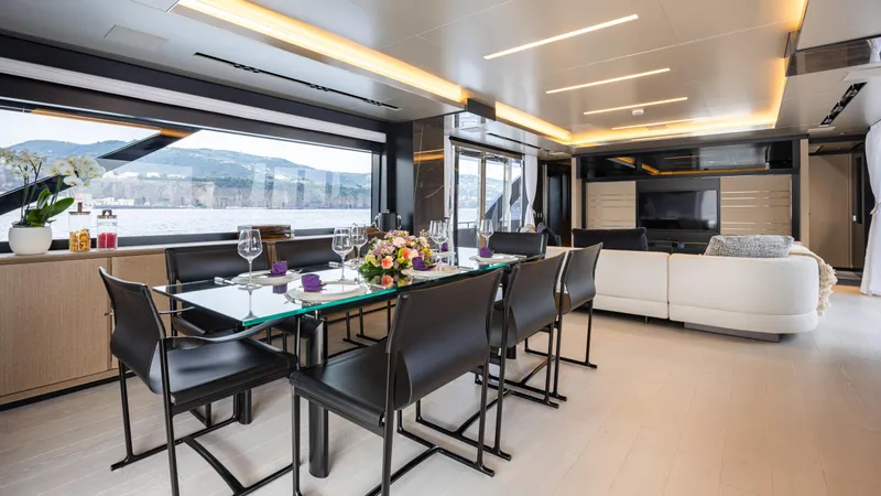 Stile Di Vita Yacht Photos Pics Luxurious interior of 2023 Riva 102 Super Cosaro yacht with elegant dining area.