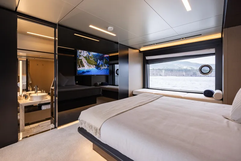 Stile Di Vita Yacht Photos Pics Luxurious bedroom interior of 2023 Riva 102 Super Cosaro yacht with scenic window view.