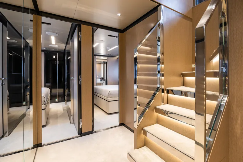 Stile Di Vita Yacht Photos Pics Luxurious interior of 2023 Riva 102 Super Cosaro yacht with modern design and elegant staircase.