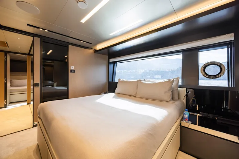 Stile Di Vita Yacht Photos Pics Luxurious bedroom interior of 2023 Riva 102 Super Cosaro yacht with large window view.