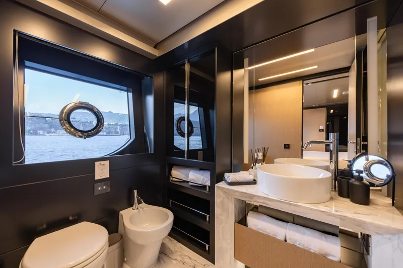 Stile Di Vita Yacht Photos Pics Luxurious bathroom on 2023 Riva 102 Super Cosaro yacht with modern fixtures and ocean view.
