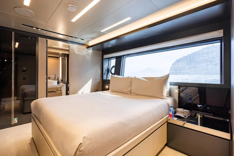 Stile Di Vita Yacht Photos Pics Luxurious bedroom interior of 2023 Riva 102 Super Cosaro yacht with scenic window view.