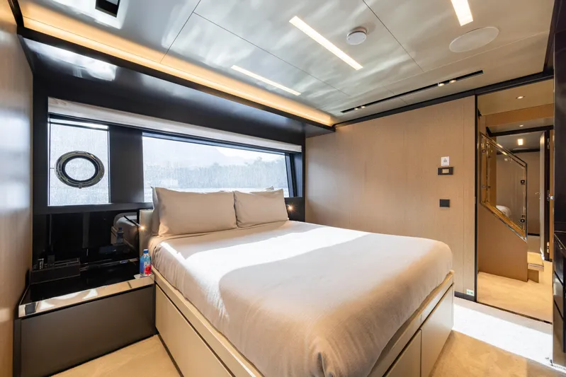 Stile Di Vita Yacht Photos Pics Luxurious bedroom interior on 2023 Riva 102 Super Cosaro yacht, featuring modern design and elegant lighting.