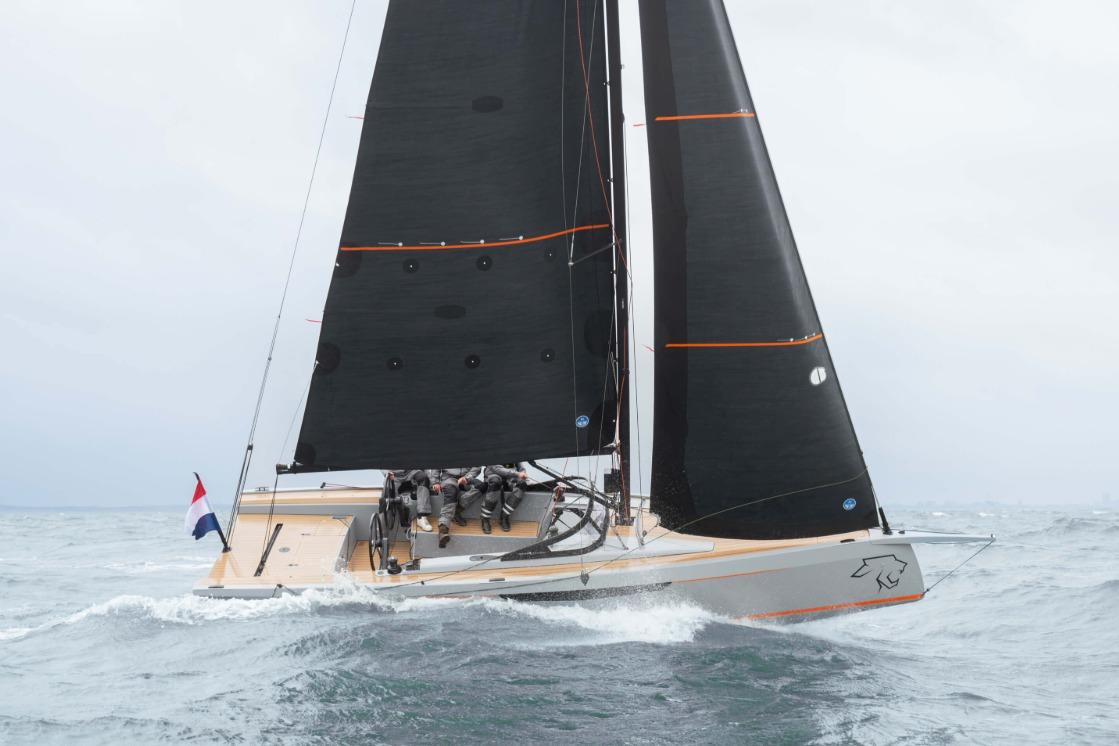 2026 Saffier SE 28 Leopard sailing in rough seas with black sails.