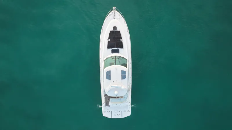  Yacht Photos Pics Overhead view of 2008 Sea Ray 48 Sundancer yacht on clear turquoise water.