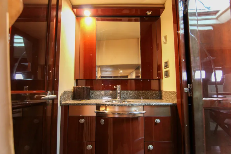  Yacht Photos Pics Luxurious bathroom interior of 2008 Sea Ray 48 Sundancer yacht with elegant wood finish.