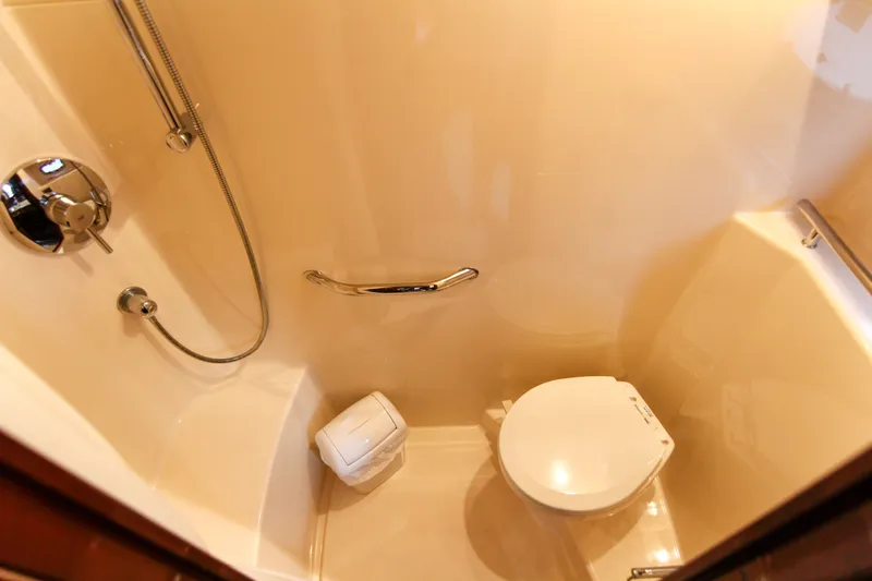  Yacht Photos Pics Bathroom interior of 2008 Sea Ray 48 Sundancer yacht, featuring shower and toilet.